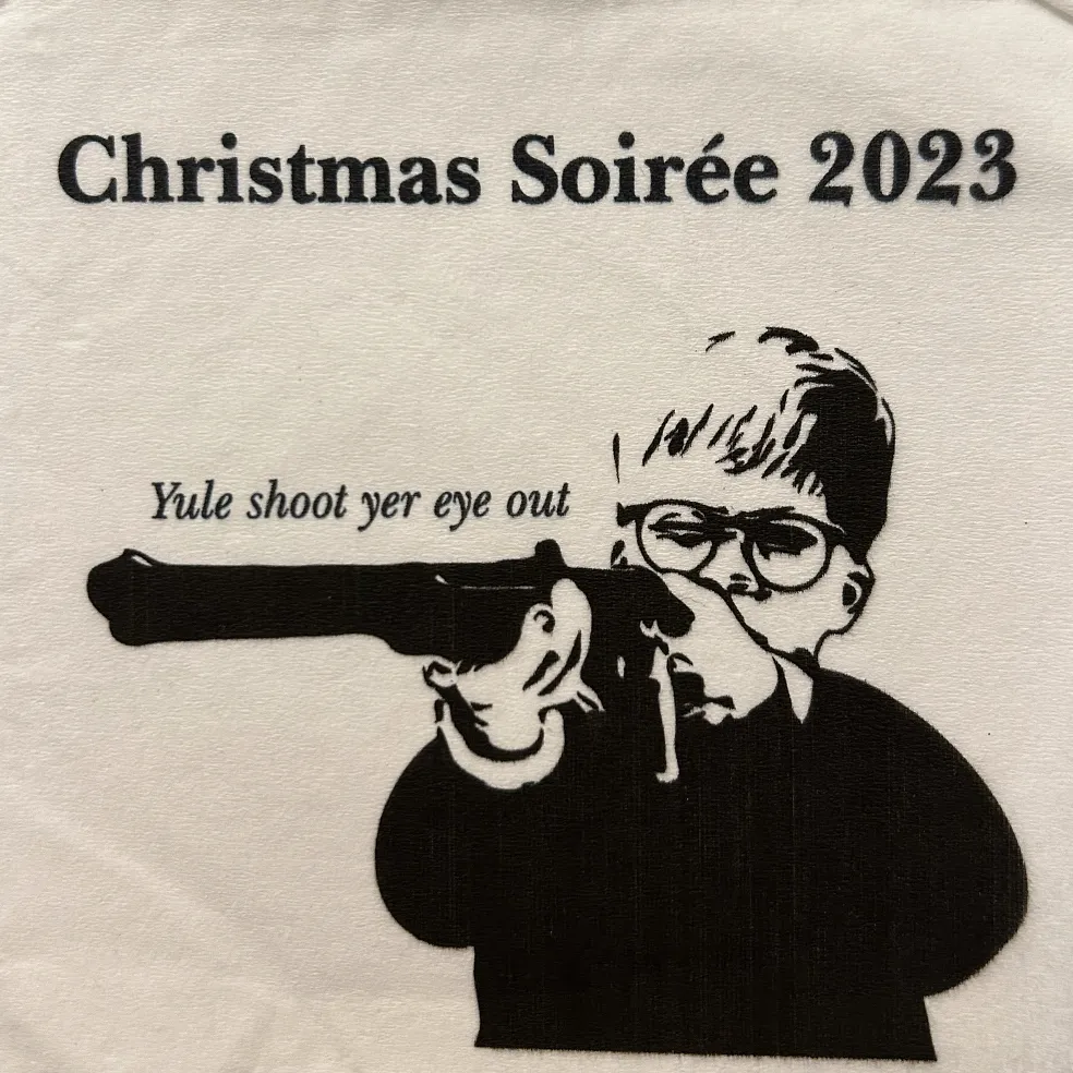 2023 napkin: Christmas Soirée 2023, “Yule shoot yer eye out”